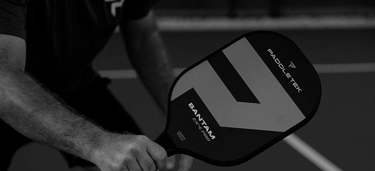 A player holding the Paddletek Bantam EX-L Pro paddle